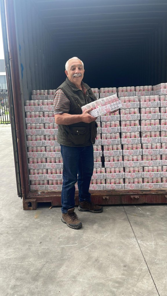 Founder at AJ Fresh Foods warehouse with product stock